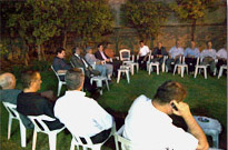 The Dizayee Tribe gathers in the family yard to mourn the loss of a loved one.