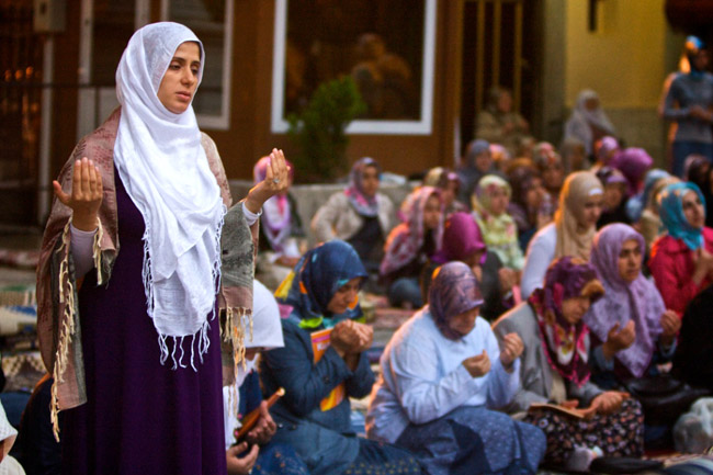 Women pray at the Eyup Mosque in Istanbul, Turkey