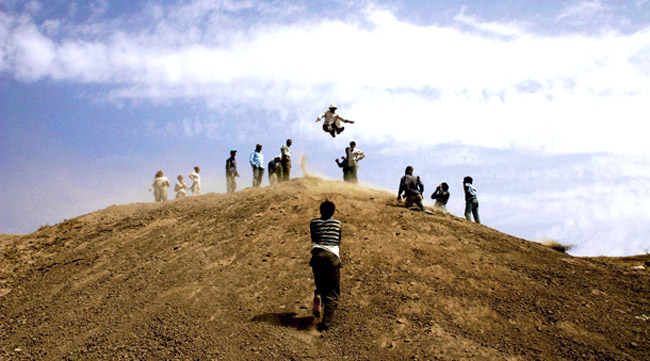 A break from excavating involves jumping out into the dirt dump